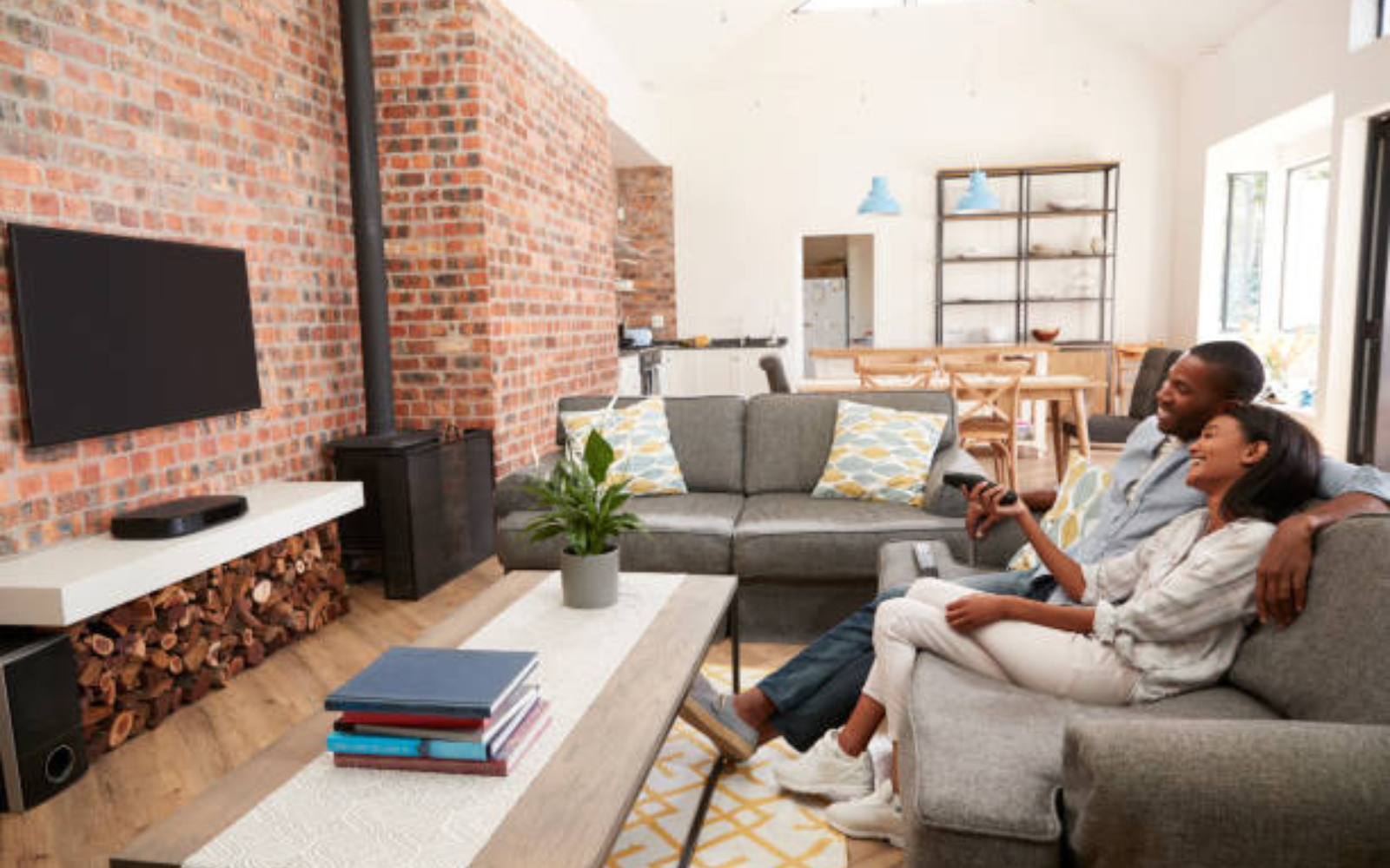 Couple relaxing comfortably together in their living room