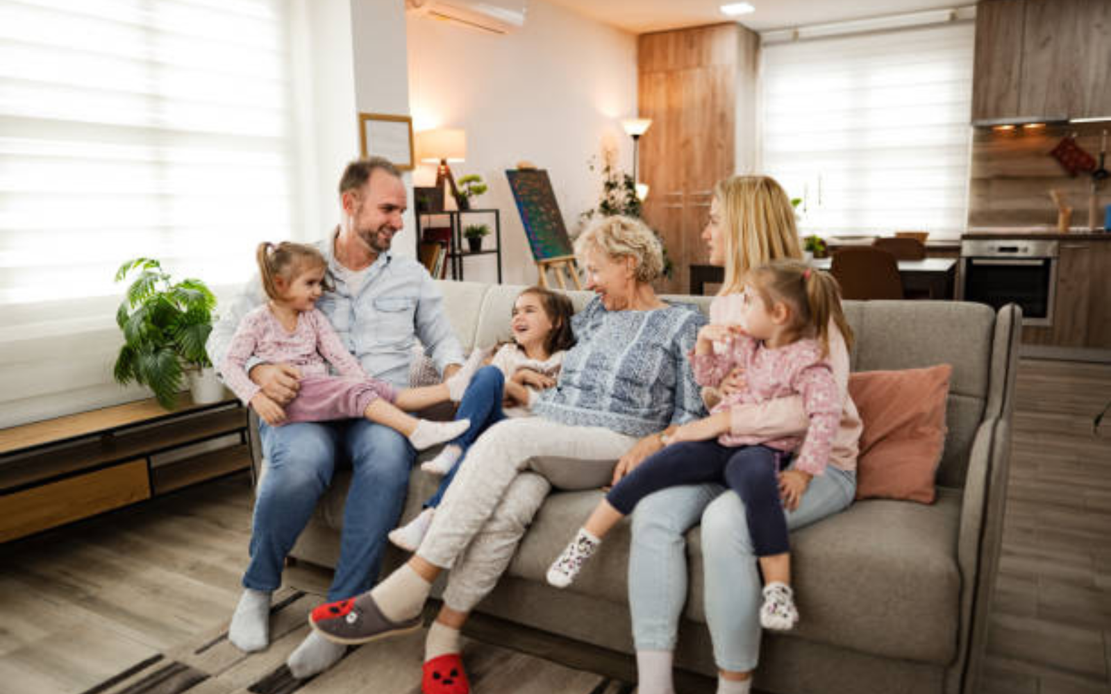Family relaxing together in a bright, comfortable living room